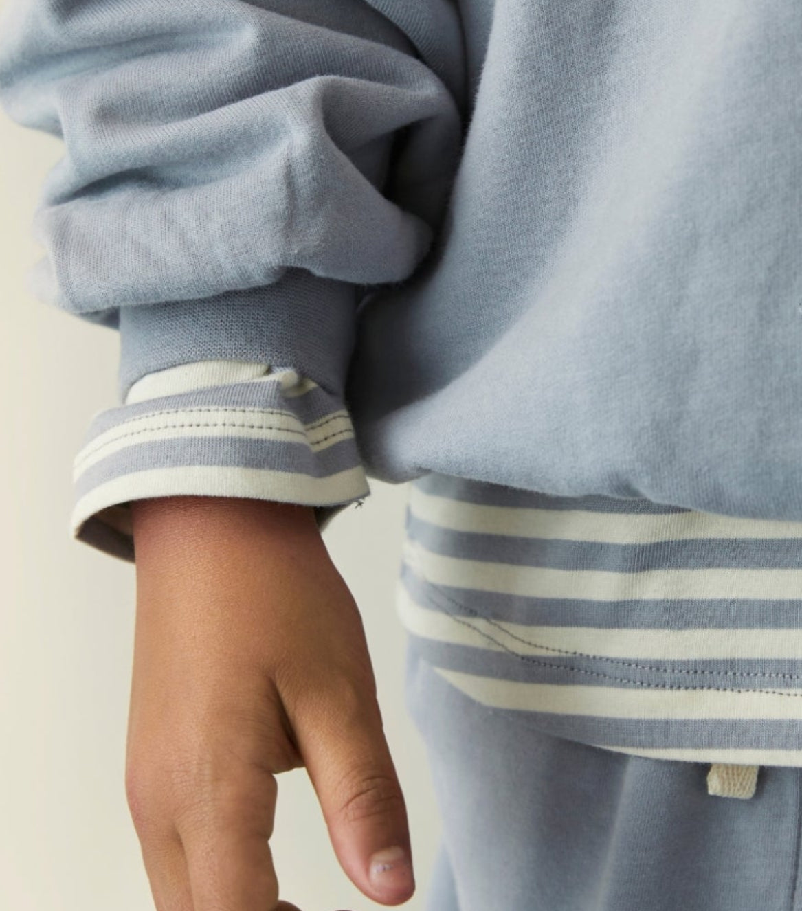 Close up Striped long sleeve top by Gray Label in color Stone Grey Layered under sweater