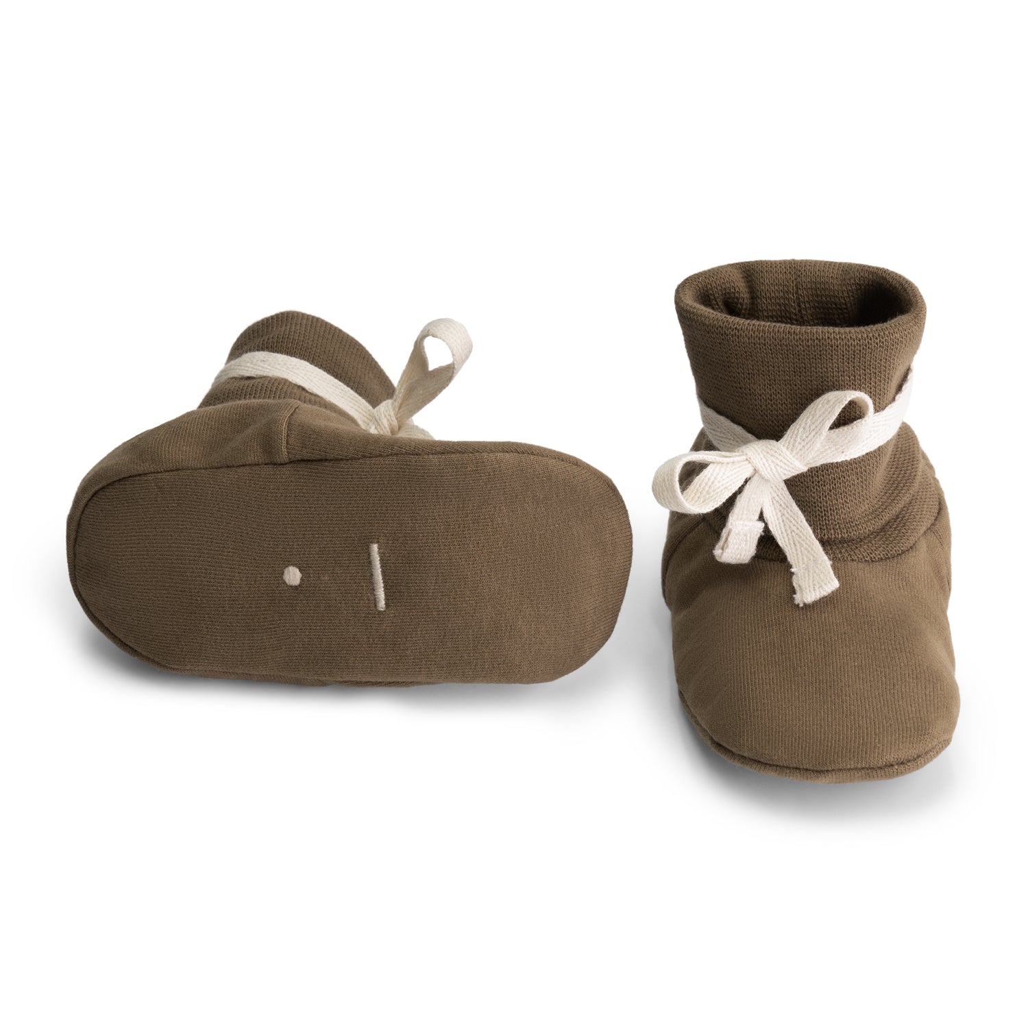 Detail of tie fastening on organic cotton fleece baby booties