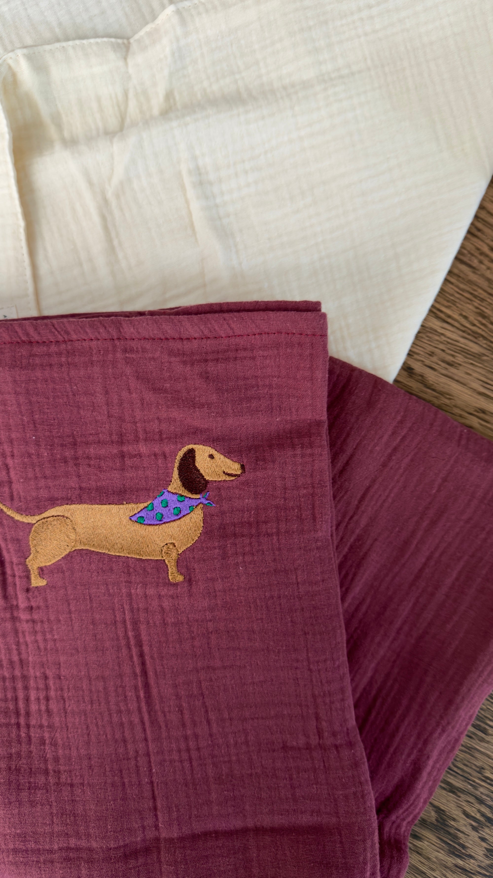 120x120 organic muslin giant swaddle in Burgundy Boo with Petit Teckel embroidery