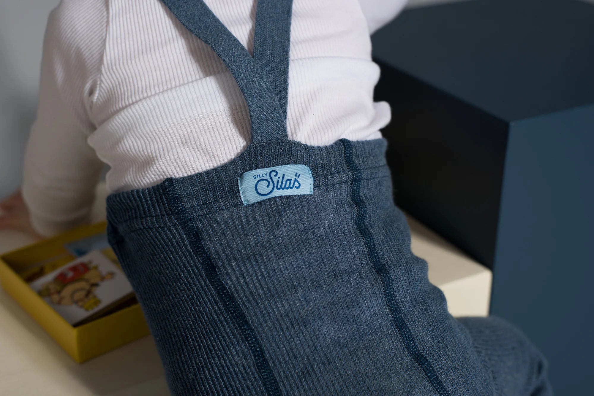 Close-up of Silly Silas organic cotton footless tights with braces in steel blue backside