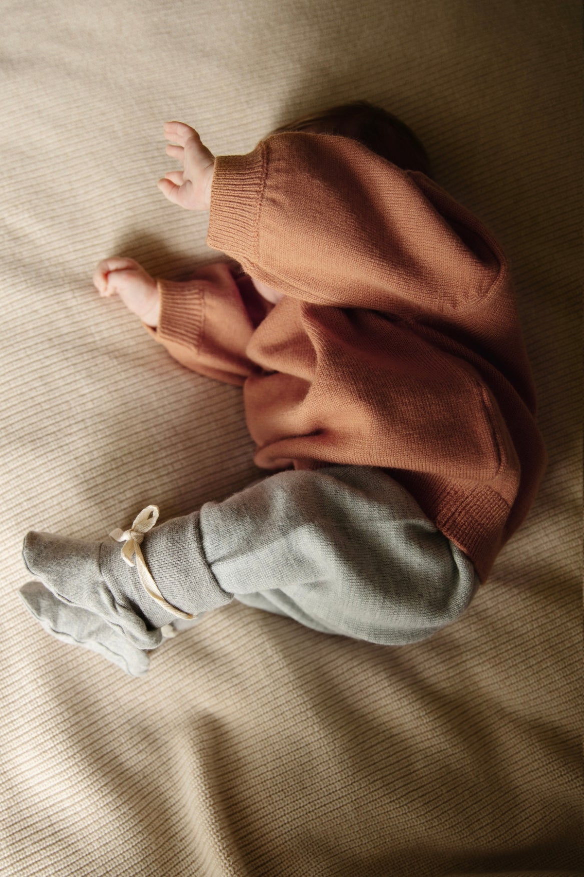 Gray label baby pants with waist tie. In colour stone grey