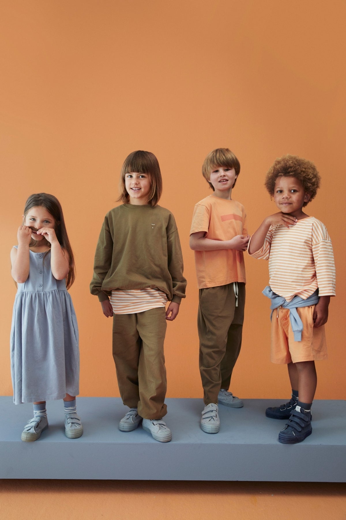 Group of kids wearing the new SS26 collection of Gray Label