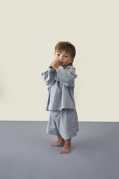 Child wearing Gray Label organic cotton oversized tee in stone grey