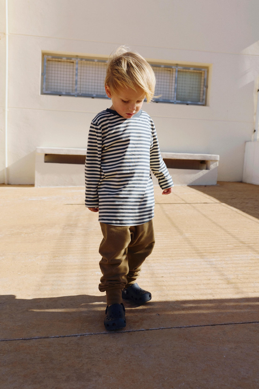 Child wearing Gray Label striped long sleeve in color blue grey