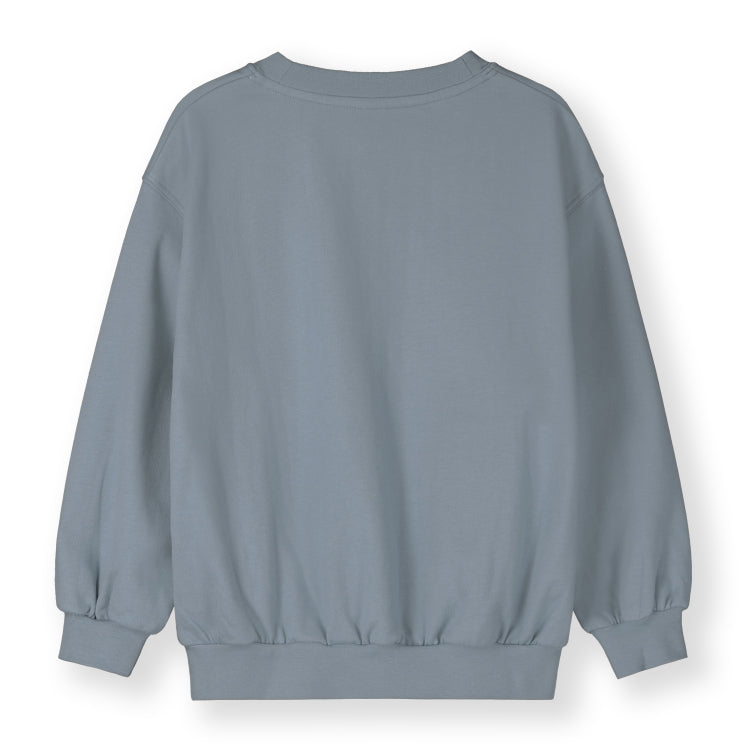 Organic cotton fleece dropped shoulder sweater made from GOTS-certified cotton, shown in blue from the back