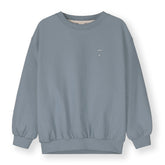 Organic cotton fleece dropped shoulder sweater made from GOTS-certified cotton, shown in blue
