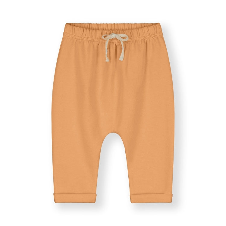 Organic cotton fleece pants made from GOTS-certified Italian fleece, shown in orange colour