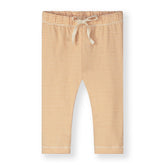 Organic cotton baby leggings made from GOTS-certified cotton, shown in orange striped colour