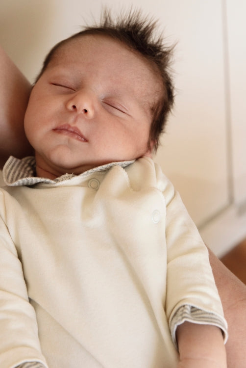 newborn sleeping in Organic cotton fleece baby suit 