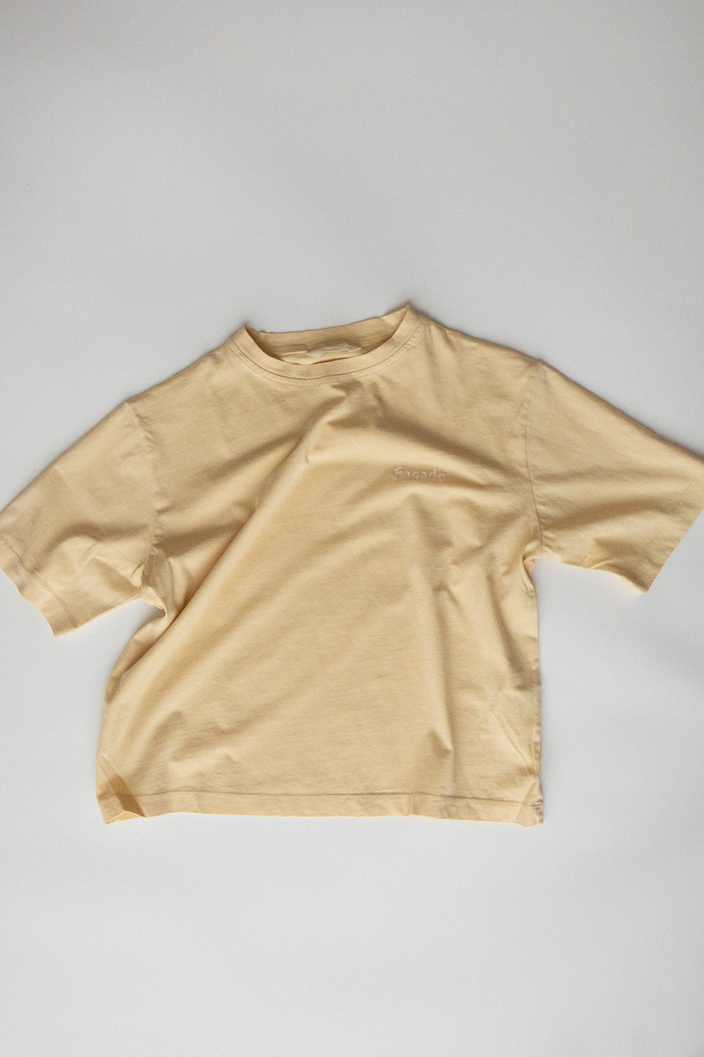 Bato Wide Tee by Façade in butter, organic cotton oversized kids t-shirt on a light background