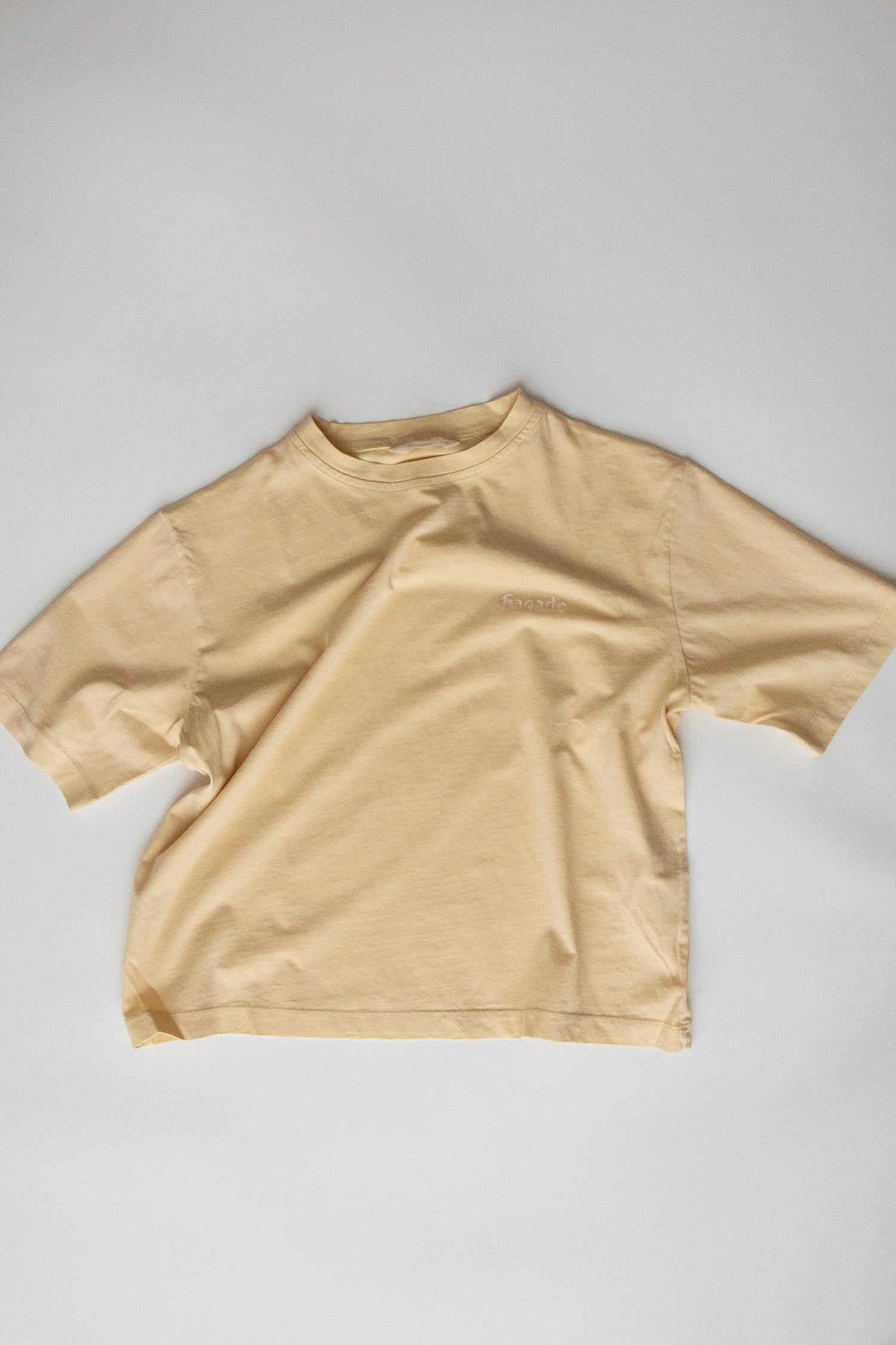 Bato Wide Tee by Façade in butter, organic cotton oversized kids t-shirt on a light background