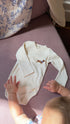 Organic cotton wrap baby bodysuit in Cozy White with sausage dog embroidery