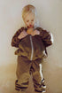 Girl wearing Gray Label Zip Cardigan in colour woody. 