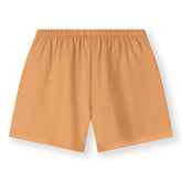 Organic cotton jersey shorts made from GOTS-certified cotton, shown in orange colour. Back side
