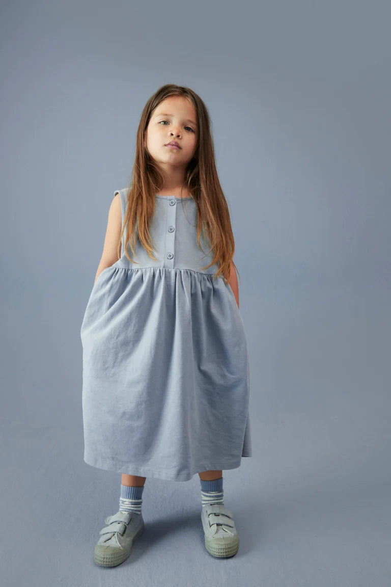 Child wearing Gray Label organic cotton jersey sleeveless dress in Stone Grey
