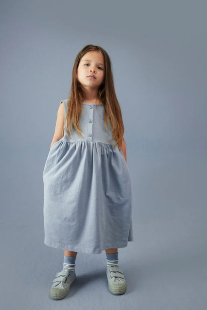 Child wearing Gray Label organic cotton jersey sleeveless dress in Stone Grey