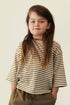 Child wearing Gray Label organic cotton oversized tee in Woody Cream